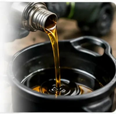 Used oil being poured into a collection container